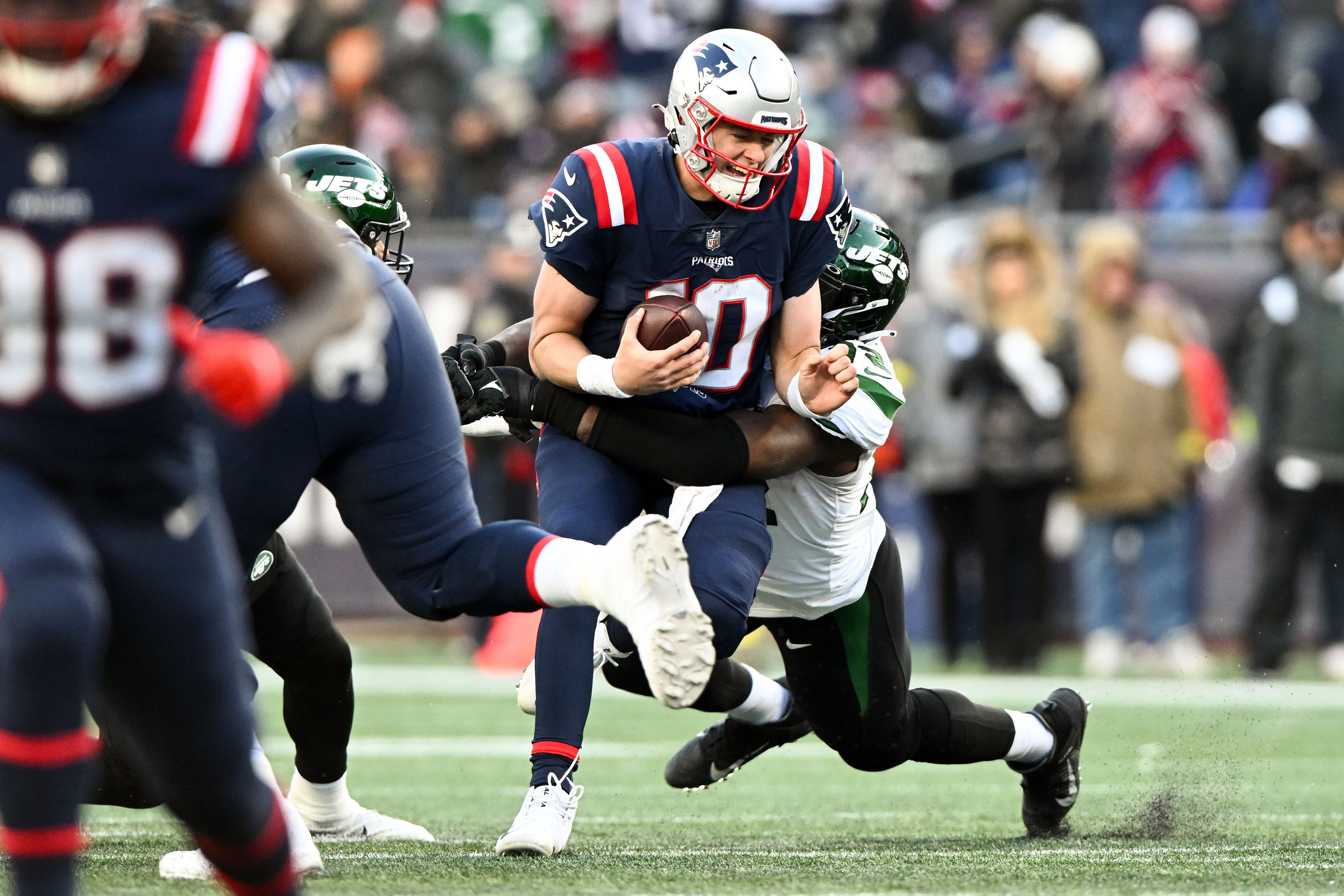 Nov 20, 2022; Foxborough, Massachusetts, USA; New York Jets defensive end Micheal Clemons (72) sacks New England Patriots quarterback Mac Jones (10) during the second half at Gillette Stadium.