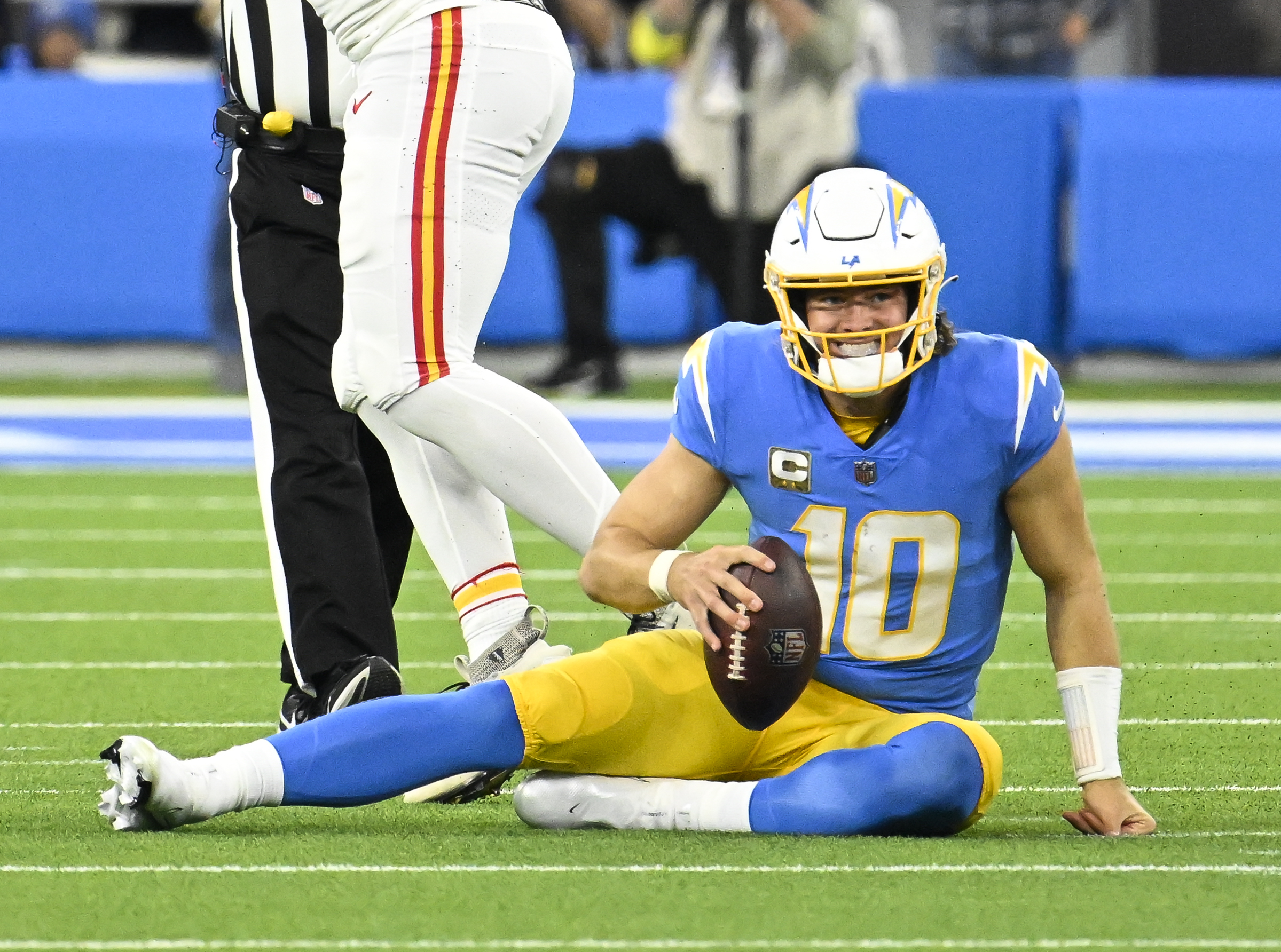 Nov 20, 2022; Inglewood, California, USA; Los Angeles Chargers quarterback Justin Herbert (10) reacts to gettin gsacked by Kansas City Chiefs defensive end Mike Danna (51) in the second quarter at SoFi Stadium. 