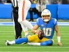 Nov 20, 2022; Inglewood, California, USA; Los Angeles Chargers quarterback Justin Herbert (10) reacts to gettin gsacked by Kansas City Chiefs defensive end Mike Danna (51) in the second quarter at SoFi Stadium. 