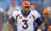 Nov 27, 2022; Charlotte, North Carolina, USA; Denver Broncos quarterback Russell Wilson (3) watches as the closing seconds tick away during the second half against the Carolina Panthers at Bank of America Stadium.