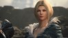 Final Fantasy 16 rating prompts release date speculation: A white woman wearing a feather-trimmed grey cloak stands imposed against a backdrop of dark stone cliffs