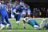 Dec 4, 2022; Detroit, Michigan, USA; Detroit Lions running back D'Andre Swift (32) leaps through a hole in the line past Jacksonville Jaguars linebacker Arden Key (49) in the fourth quarter at Ford Field.