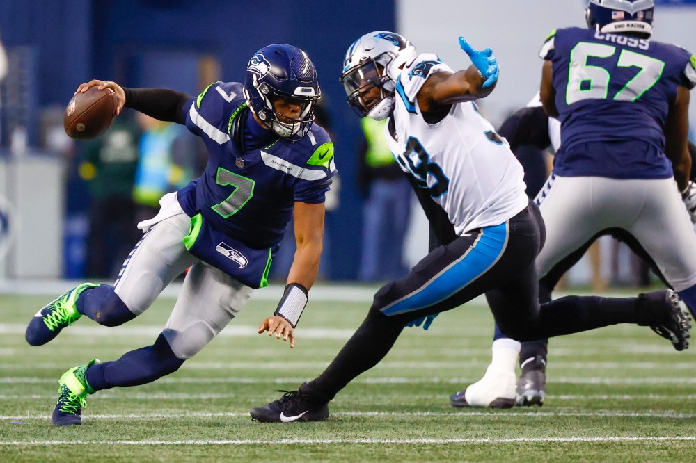 Dec 11, 2022; Seattle, Washington, USA; Carolina Panthers defensive end Marquis Haynes Sr. (98) sacks Seattle Seahawks quarterback Geno Smith (7) during the fourth quarter at Lumen Field.