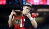 INGLEWOOD, CALIFORNIA - JANUARY 09: Stetson Bennett #13 of the Georgia Bulldogs celebrates with teammates and a cigar after defeating the TCU Horned Frogs in the College Football Playoff National Championship game at SoFi Stadium on January 09, 2023 in Inglewood, California. Georgia defeated TCU 65-7.