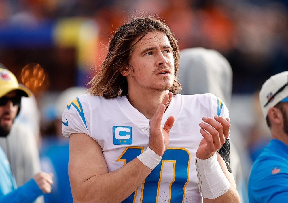 Jan 8, 2023; Denver, Colorado, USA; Los Angeles Chargers quarterback Justin Herbert (10) reacts in the second quarter against the Denver Broncos at Empower Field at Mile High.