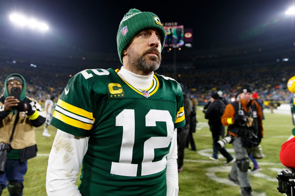 Aaron Rodgers walks off Lambeau Field after playing the Lions.