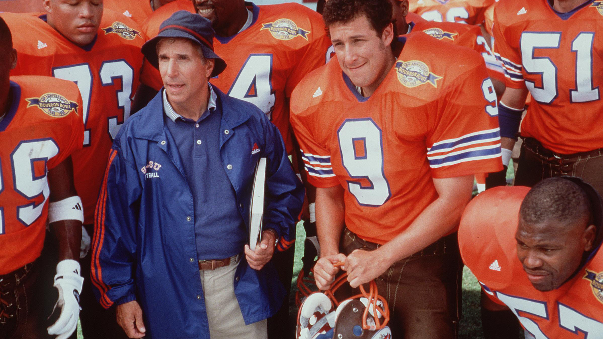 henry winkler and adam sandler filming a scene from the waterboy