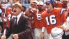 gene hackman stands in front of a group of football players in orange jerseys during a scene from the replacements