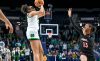 Notre Dame sophomore guard Olivia Miles, wearing a white uniform, takes a mid-range shot against Louisville.