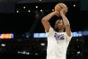 Kevin Durant is taking a jump shot during warmups.
