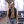 Dillon wears a black vest without a shirt and jorts before a game against the Lakers.