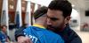 brett goldstein and phil dunster hug in a locker room during a scene of apple tv's hit show ted lasso