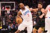 Kawhi Leonard is fighting to dribble around a screen with Klay Thompson on his hip.