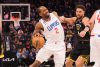 Kawhi Leonard is fighting to dribble around a screen with Klay Thompson on his hip.