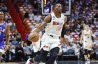 Heat center Bam Adebayo dribbles the ball against the 76ers.
