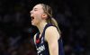 Paige Bueckers screams in reaction to something during a game.