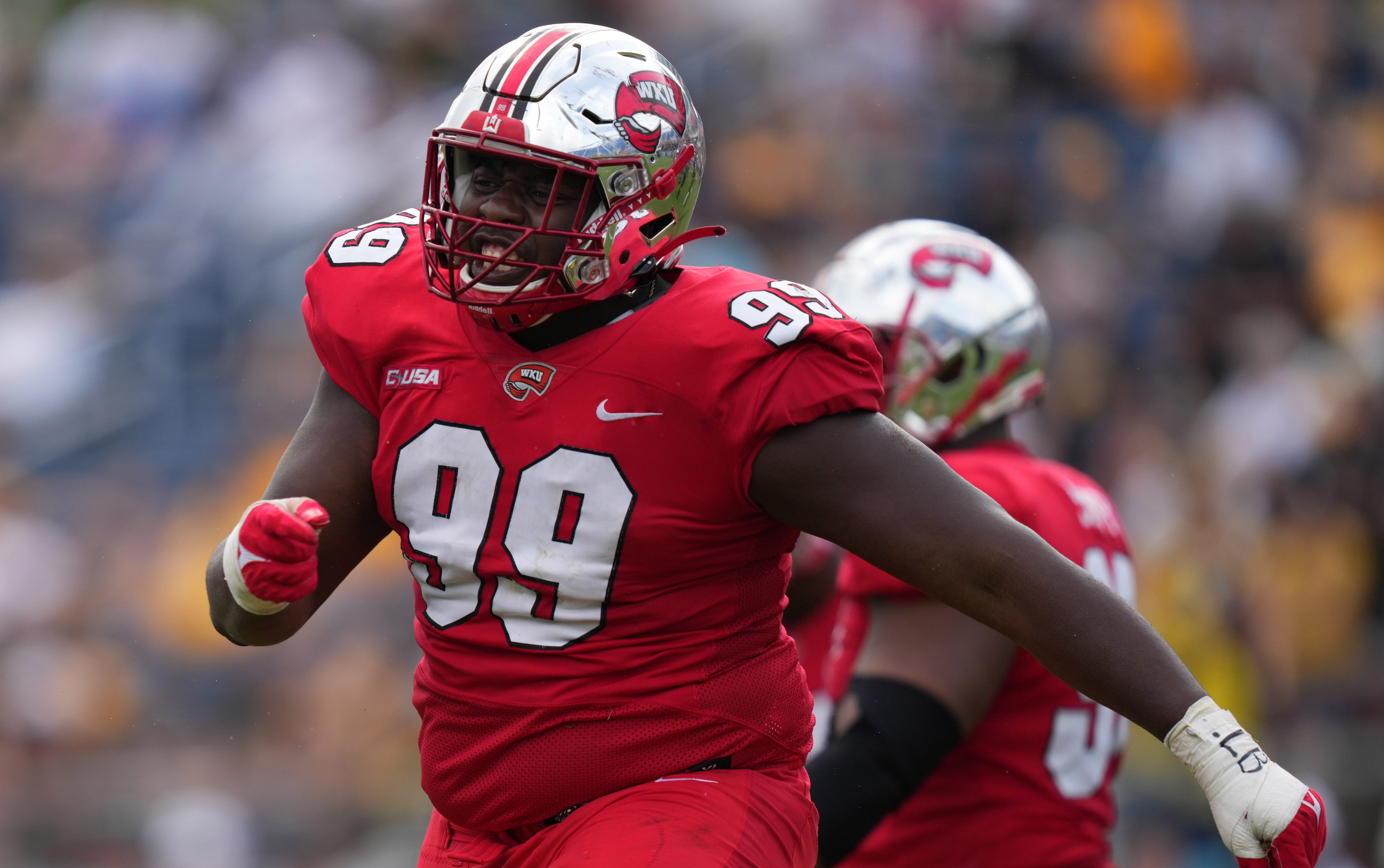 Dec 18, 2021; Boca Raton, Florida, USA; Western Kentucky Hilltoppers defensive tackle Brodric Martin (99) celebrates after making a tackle against the Appalachian State Mountaineers during the second half in the 2021 Boca Raton Bowl at FAU Stadium.