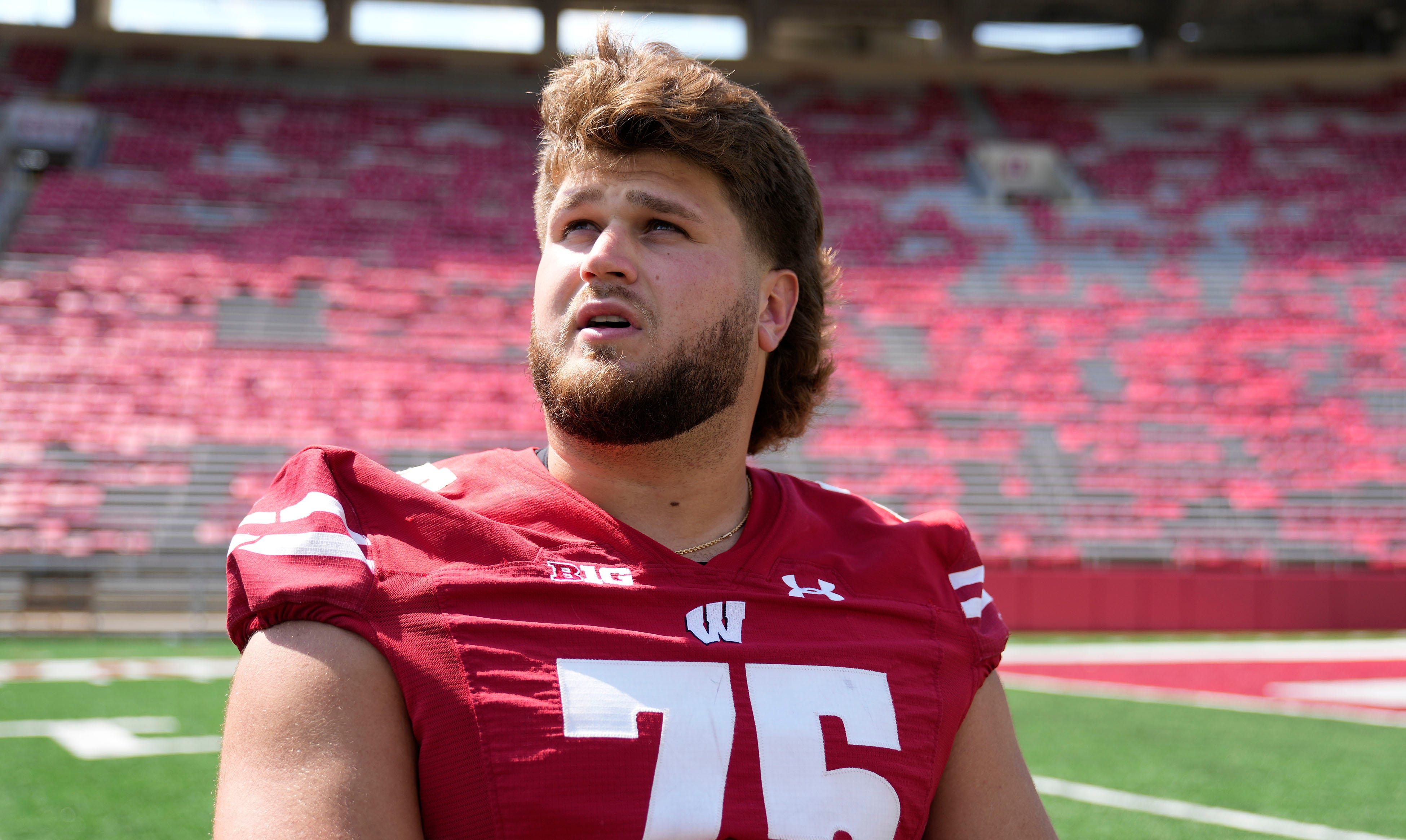 Wisconsin Badgers offensive lineman Joe Tippmann (75) talks to the media as part of Wisconsin Badgers football media day at Camp Randall Stadium in Madison on Tuesday, Aug. 2, 2022.