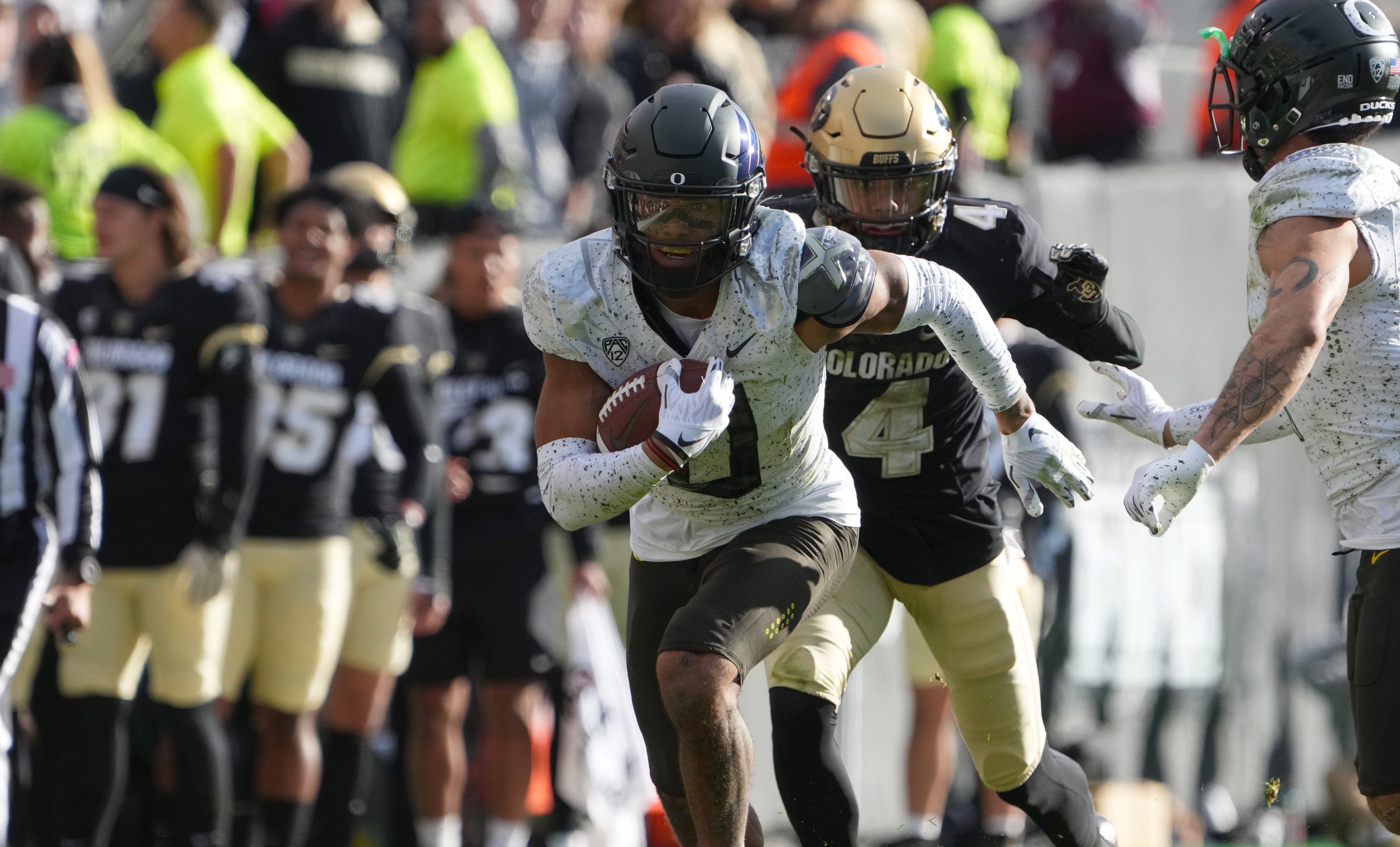 Nov 5, 2022; Boulder, Colorado, USA; Oregon Ducks defensive back Christian Gonzalez (0) returns a interception in the third quarter against the Colorado Buffaloes at Folsom Field.