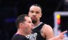 Apr 22, 2023; Los Angeles, California, USA; NBA referee Ed Malloy (14) makes a call as Memphis Grizzlies forward Dillon Brooks (24) watches in the second quarter during game three of the 2023 NBA playoffs against the Los Angeles Lakers at Crypto.com Arena.