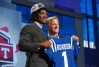 Anthony Richardson posing next to Roger Goodell with a jersey in hand after being drafted by the Colts.