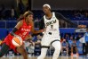 Atlanta Dream guard Rhyne Howard (10) drives to the basket against Chicago Sky guard Kahleah Copper
