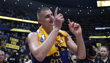 Nikola Jokic gestures with his fingers after winning NBA Finals.