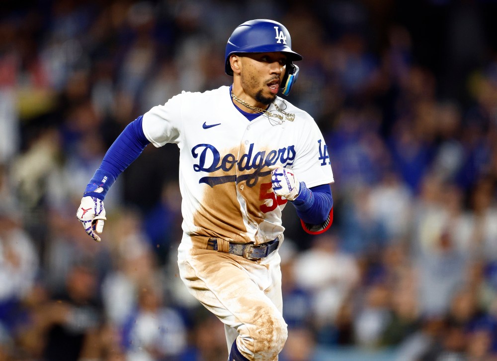 Dodgers' Mookie Betts running the bases after hitting a single.
