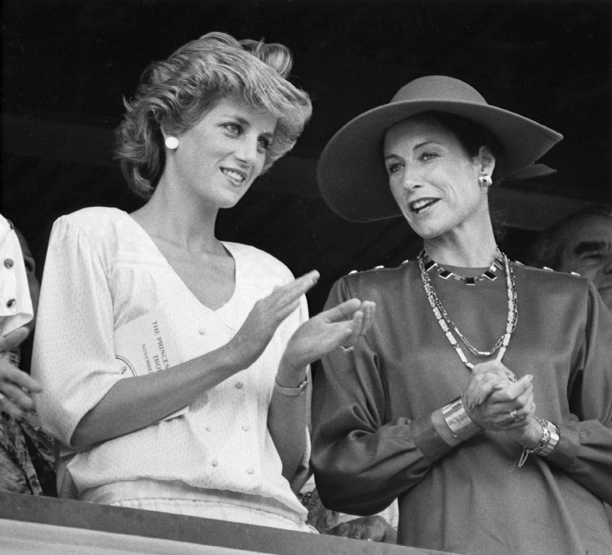 11/12/85 - Princess Diana, left and Jane Ylivisaker of the Palm Beach Polo and Country Club chat while Prince Charles competes in a polo match in this photo November 12, 1985 in Palm Beach.Prince Charles In Palm Beach County Over The Years 05