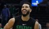 Feb 12, 2023; Boston, Massachusetts, USA; Boston Celtics forward Jayson Tatum (0) smiles as he warms up before their game against the Memphis Grizzlies at TD Garden.