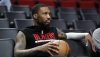 Mar 27, 2023; Portland, Oregon, USA; Portland Trail Blazers point guard Damian Lillard (0) watches players warm up prior to the game against the New Orleans Pelicans at Moda Center.