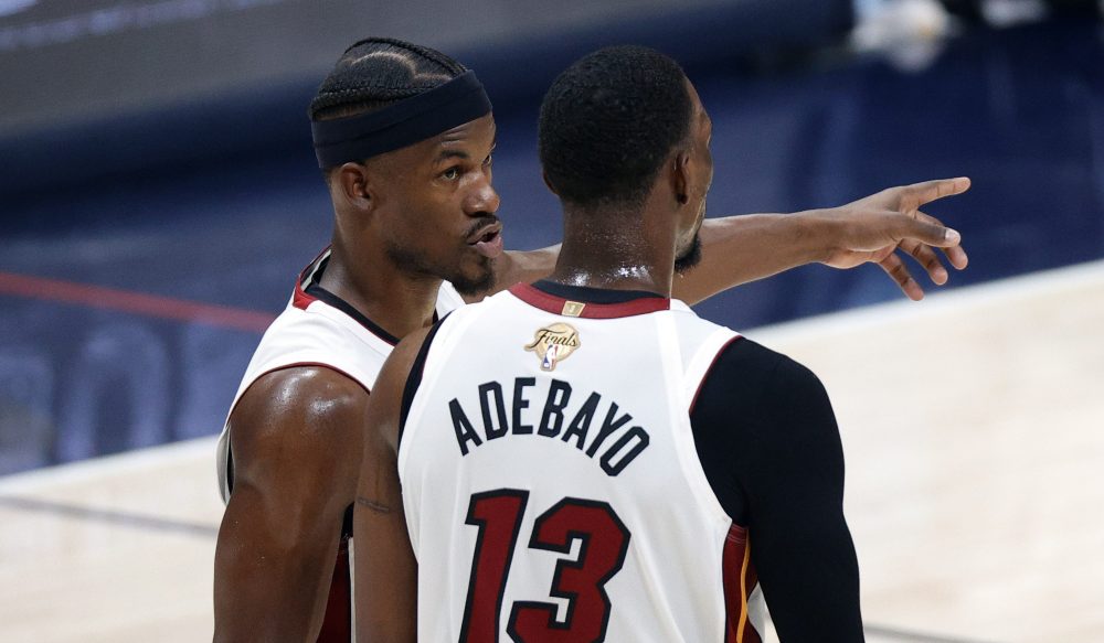 Jun 4, 2023; Denver, CO, USA; Miami Heat forward Jimmy Butler (22) and center Bam Adebayo (13) talk in the second quarter against the Denver Nuggets in game two of the 2023 NBA Finals at Ball Arena.