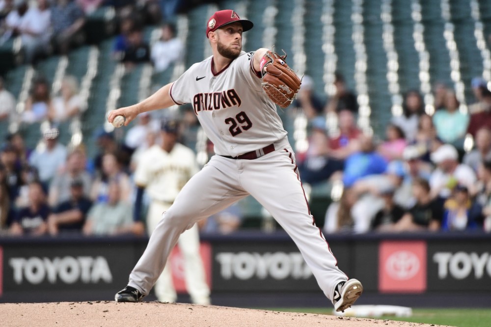 Diamondbacks starting pitcher Merrill Kelly throwing a pitch.