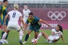 Jul 27, 2021; Ibaraki, Japan; Australia player Sam Kerr (2) dribbles around USA player Julie Ertz (8) and USA player Christen Press (11) during the Tokyo 2020 Olympic Summer Games at Ibaraki Kashima Stadium. 