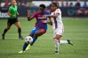 Aug 18, 2021; Portland, OR, USA; FC Barcelona forward Asisat Oshoala (20) dribbles the ball against Olympique Lyonnais defender Alice Sombath (18) during the second half at Providence Park. Olympique Lyonnais won 3-2. 