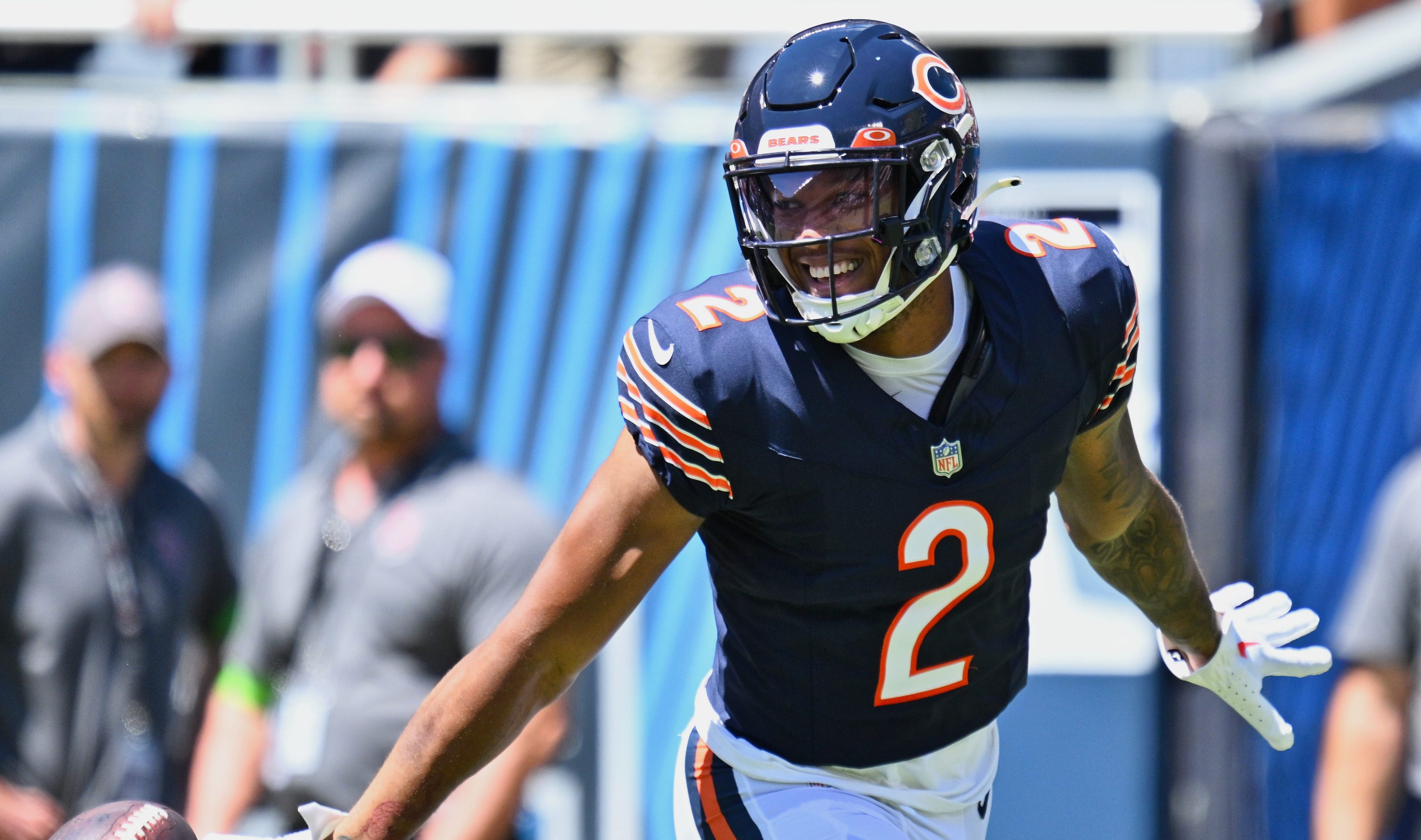 Aug 12, 2023; Chicago, Illinois, USA; Chicago Bears wide receiver DJ Moore (2) celebrates after scoring on a 62-yard touchdown catch and run in the first quarter against the Tennessee Titans at Soldier Field.