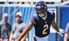 Aug 12, 2023; Chicago, Illinois, USA; Chicago Bears wide receiver DJ Moore (2) celebrates after scoring on a 62-yard touchdown catch and run in the first quarter against the Tennessee Titans at Soldier Field.