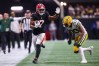 Sep 17, 2023; Atlanta, Georgia, USA; Atlanta Falcons running back Bijan Robinson (7) is pushed out of bounds by Green Bay Packers safety Rudy Ford (20) in the second half at Mercedes-Benz Stadium.