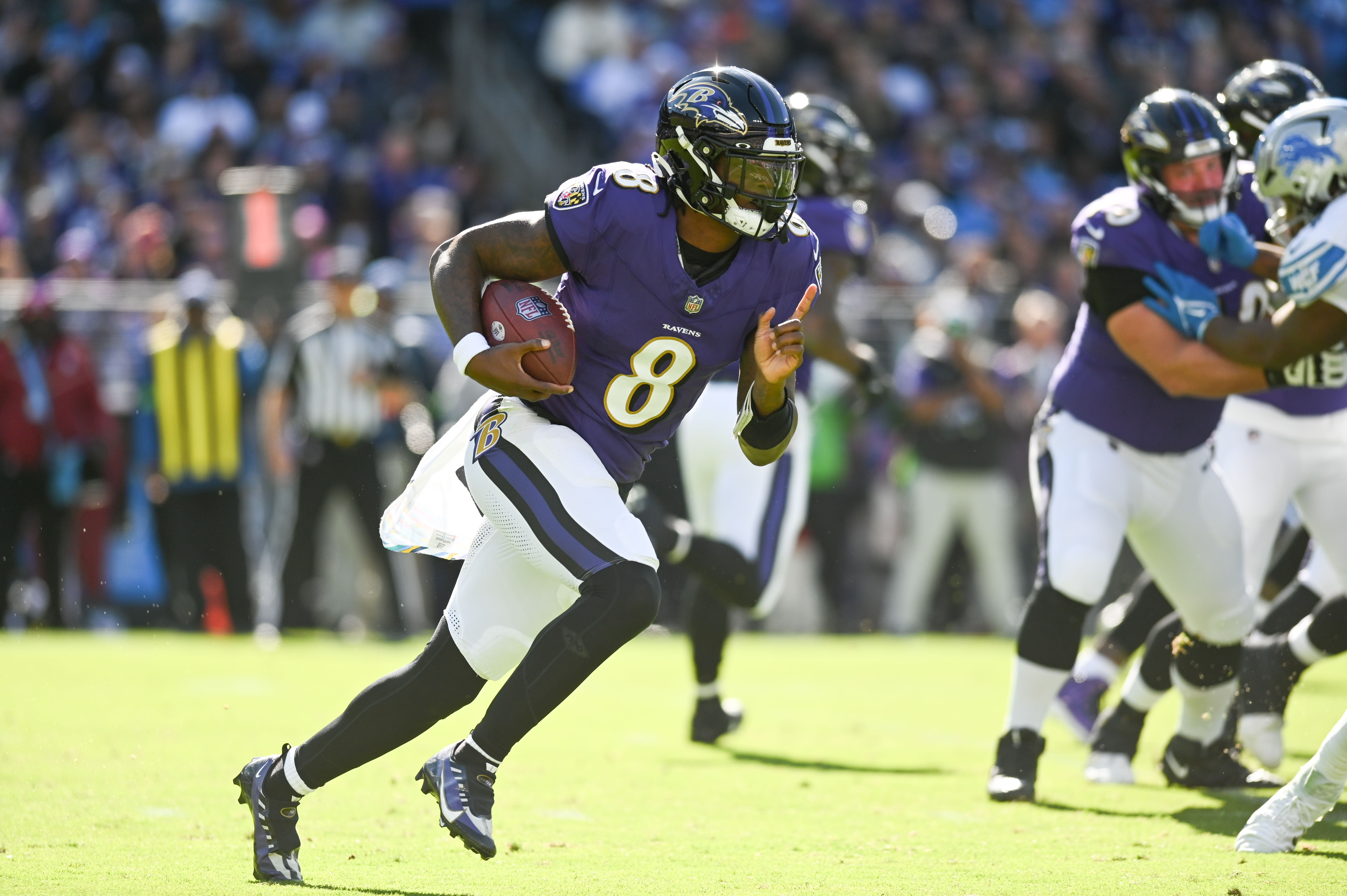 Oct 22, 2023; Baltimore, Maryland, USA; Baltimore Ravens quarterback Lamar Jackson (8) rushes during the first half against the Detroit Lions at M&T Bank Stadium.