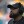 Pittsburgh Steelers head coach Mike Tomlin, wearing a black Steelers hat and headset, looks up at the video replay in a game against the Jacksonville Jaguars at Acrisure Stadium
