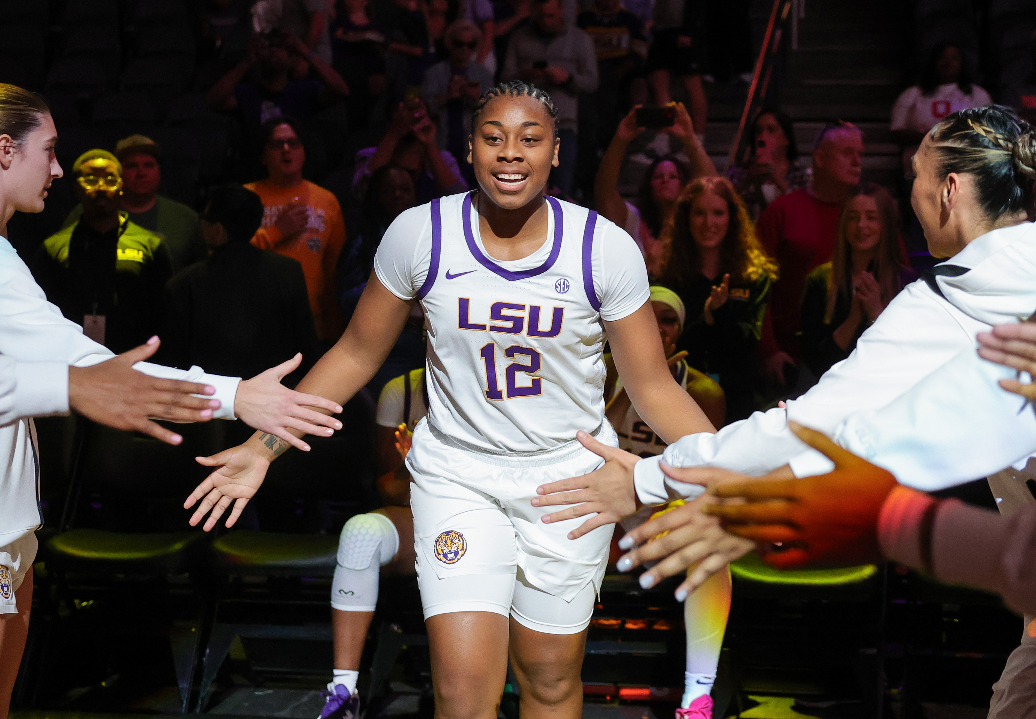 Mikaylah Williams #12 of the LSU Lady Tigers is introduced before a game during the Naismith Basketball Hall of Fame Series at T-Mobile Arena
