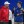 Peyton Manning (left, wearing a red AFC sweatshirt and white hat) and Eli Manning (right, wearing a blue NFC sweatshirt) at the Intermountain Healthcare Performance Facility