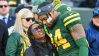 Nov 19, 2023; Green Bay, Wisconsin, USA; Green Bay Packers safety Jonathan Owens (34) hugs his wife, Olympic gymnast Simone Biles, before game against the Los Angeles Chargers at Lambeau Field.