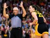 Iowa guard Caitlin Clark (22) reacts after scoring a three point shot at the Kohl Center