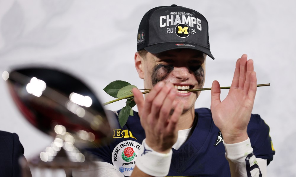PASADENA, CALIFORNIA - JANUARY 01: J.J. McCarthy #9 of the Michigan Wolverines celebrates after beating the Alabama Crimson Tide 27-20 in overtime to win the CFP Semifinal Rose Bowl Game at Rose Bowl Stadium on January 01, 2024 in Pasadena, California. (Photo by Sean M. Haffey/Getty Images)