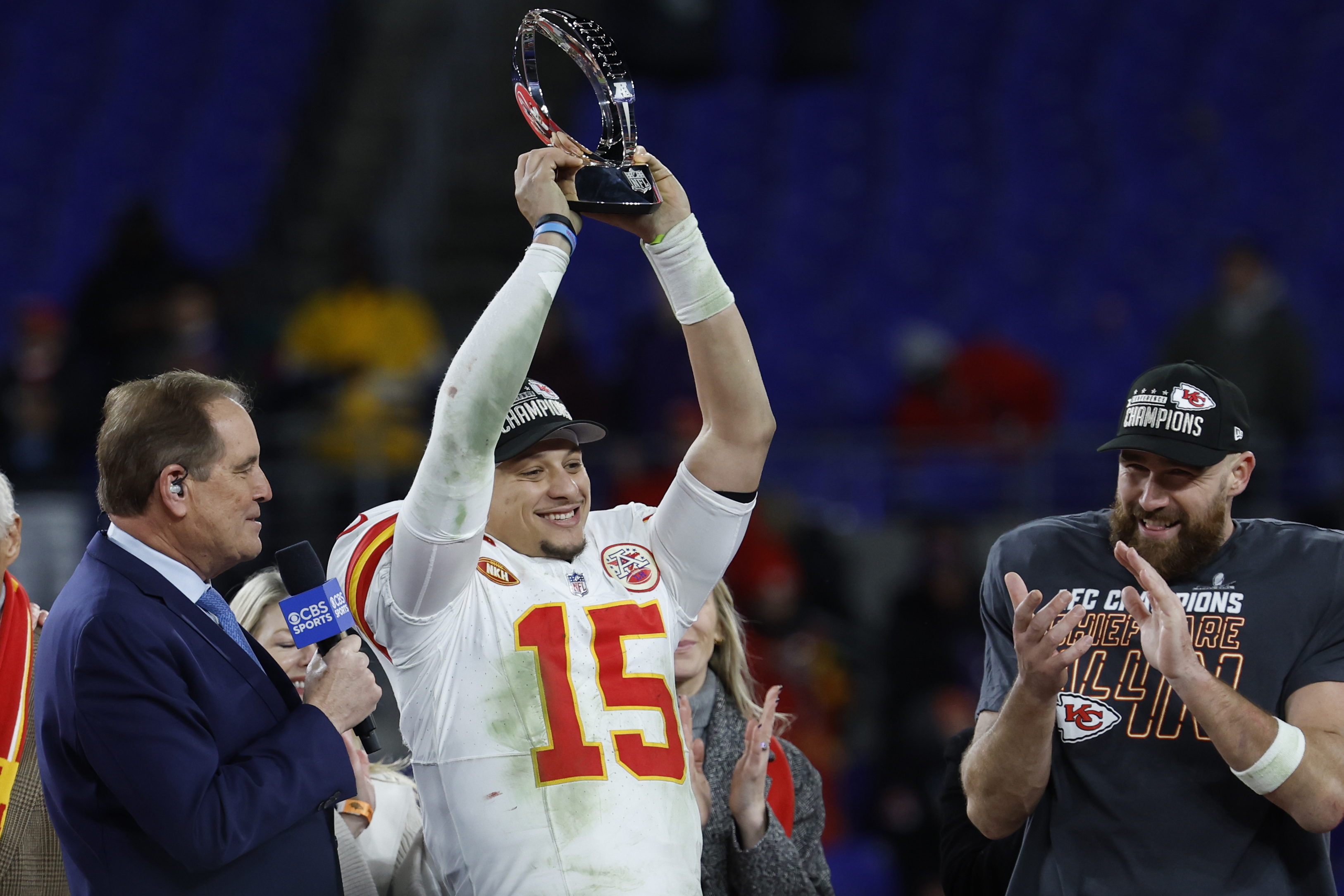 Kansas City Chiefs quarterback Patrick Mahomes (15) celebrates with the Lamar Hunt Trophy while speaking with CBS broadcaster Jim Nance during the trophy presentation after the Chiefs' game against the Baltimore Ravens in the AFC Championship football game