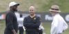 Jul 27, 2023; Latrobe, PA, USA; Pittsburgh Steelers head coach Mike Tomlin (left) and general manager Omar Khan (middle) and chairman Art Rooney II talk on the field during training camp at Saint Vincent College.