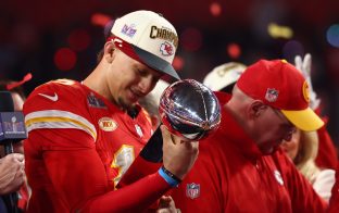 Feb 11, 2024; Paradise, Nevada, USA; Kansas City Chiefs quarterback Patrick Mahomes (15) celebrates with the Vince Lombardi Trophy after defeating the San Francisco 49ers in Super Bowl LVIII at Allegiant Stadium.