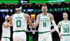 Feb 14, 2024; Boston, Massachusetts, USA; Boston Celtics center Kristaps Porzingis (8) and forward Jayson Tatum (0) react after a play against the Brooklyn Nets in the first half at TD Garden.