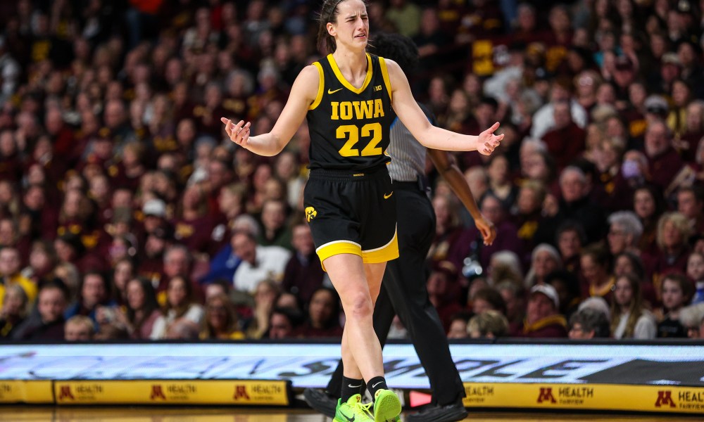 Iowa Hawkeyes guard Caitlin Clark (22) reacts after an offensive foul was called against her during the first half against the Minnesota Golden Gophers at Williams Arena